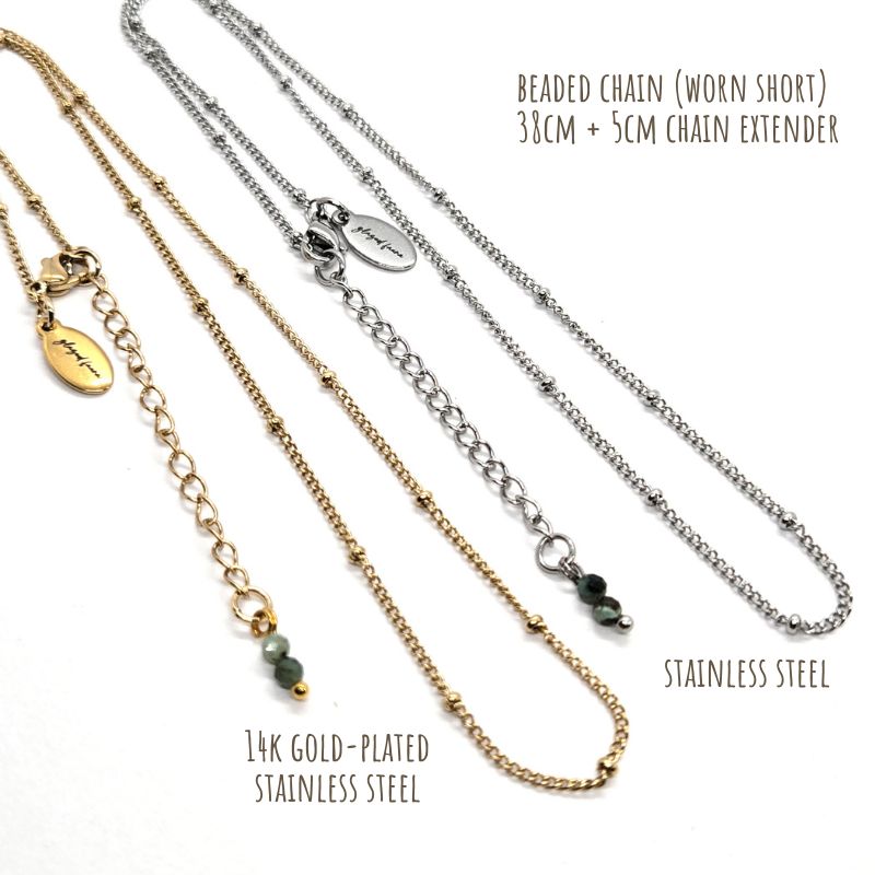 Glazed Fauna 14K gold-plated stainless-steel beaded chain and stainless steel beaded chain.