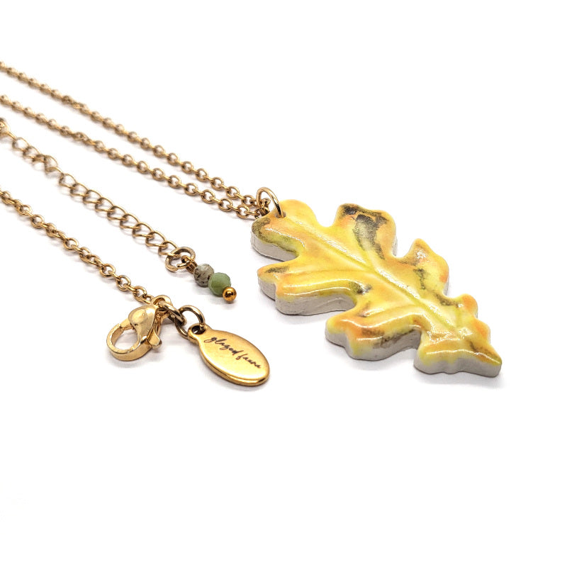 Autumn Oak Leaf ceramic pendant necklace with Glazed Fauna gold-plated brand tag