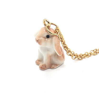 Side view of brown lop rabbit ceramic pendant