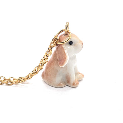 Right side view of brown lop rabbit ceramic pendant