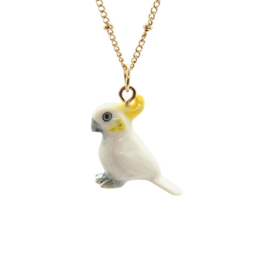 A ceramic Yellow-crested cockatoo pendant on a gold-plated stainless steel beaded chain. 