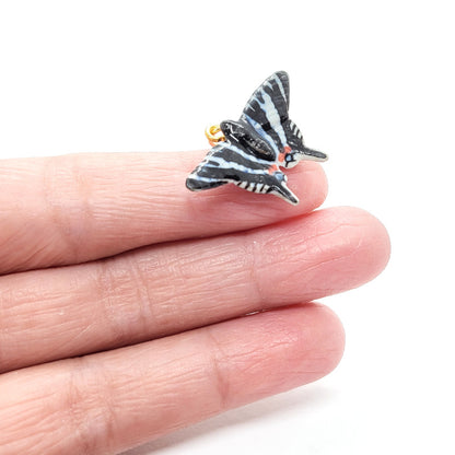 Zebra Swallowtail Butterfly pendant on finger