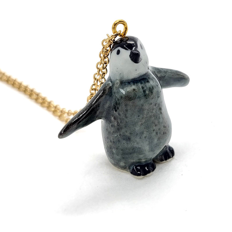 Baby penguins are adorable fluff balls of heartwarming cuteness! Start your ceramic animal jewellery collection with this adorable baby Emperor penguin, or get it as a gift for a special someone! Comes with a stainless steel or an 18K gold-plated cable chain. Penguin pendant is 3cm tall, 3.8cm long.